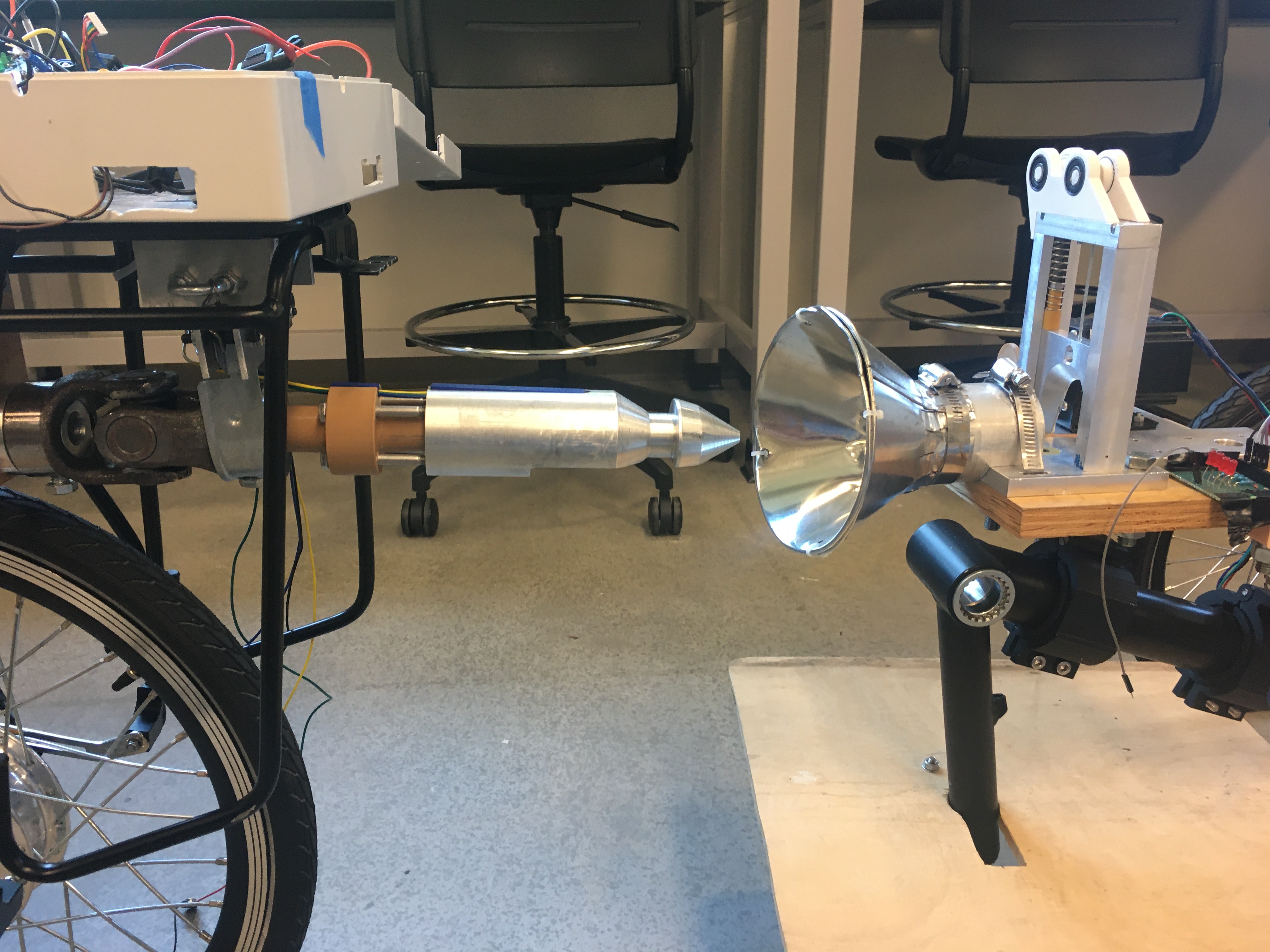 The coupling system for two autonomous trikes. The left trike has the protuding portion of the system. The right trike has recessed portion of the system.